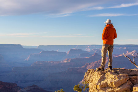 Traveler on cliff mountains over Grand Canyon National Park, Arizona, USA.Inspiring emotion. Travel Lifestyle journey success motivation concept adventure  vacations outdoor concept.の写真素材