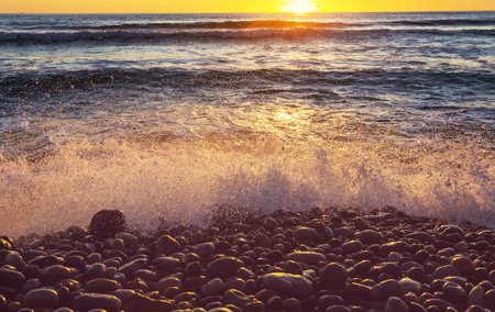 Blue wave on the beach. Dramatic natural background.