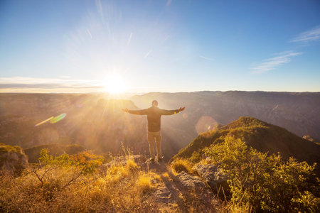 Tourist at sunrise in mountains Barrancas del Cobro, Mexicoの写真素材