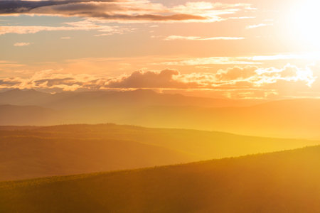 mountain silhouette at sunrise in spring seasonの写真素材