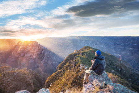 Tourist at sunrise in mountains Barrancas del Cobro, Mexicoの写真素材