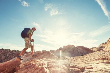 Hike in the Utah mountains. Hiking in unusual natural landscapes. Fantastic forms sandstone formations.の写真素材