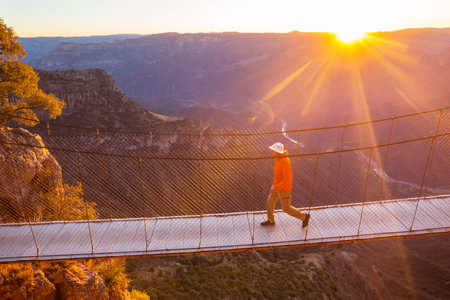 Man on the suspension bridge in Barrancas mountains, Mexicoの写真素材