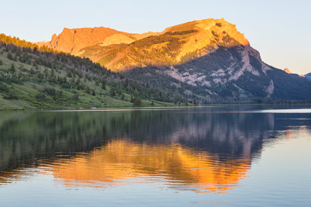 Serenity lake in the mountains in summer season. Beautiful natural landscapes.