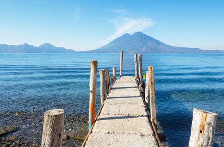 Beautiful lake Atitlan and volcanos in the highlands of Guatemala, Central Americaの写真素材