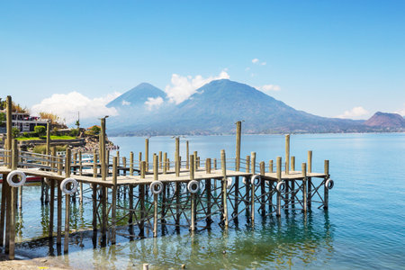 Beautiful lake Atitlan and volcanos in the highlands of Guatemala, Central Americaの写真素材