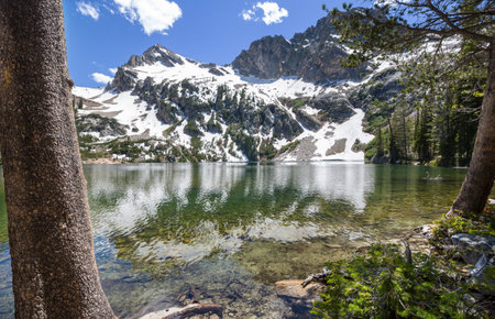 Serenity lake in the mountains in summer season. Beautiful natural landscapes.