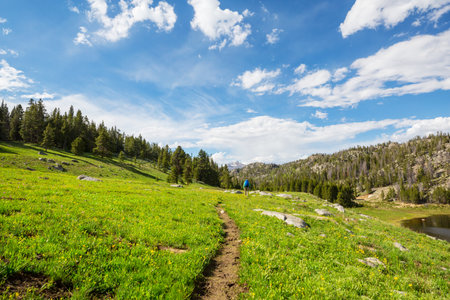 hiker in mountains on beautiful rock background