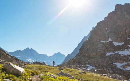 hiker in mountains on beautiful rock background