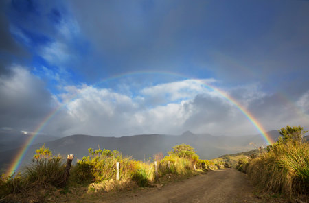 Rainbow above mountains. Beautiful natural landscapes. Picturesque nature.の写真素材