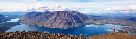 Hiking man in Canadian mountains. Hike is the popular recreation activity in North America. There are a lot of picturesque trails.の写真素材