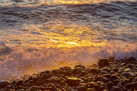 Blue wave on the beach. Dramatic natural background.の写真素材