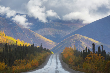 Mountain road in autumn season, Alaskaの写真素材
