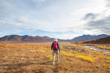 Hike in the autumn mountains. Fall season theme.の写真素材