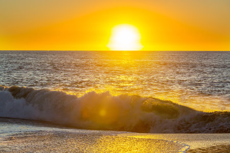 Blue wave on the beach. Dramatic natural background.の写真素材