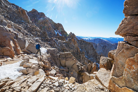 hiker in mountains on beautiful rock backgroundの写真素材