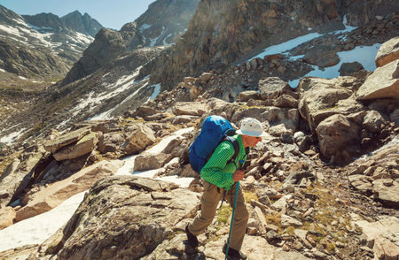 hiker in mountains on beautiful rock background
