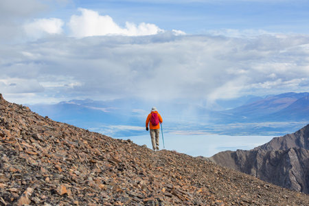Hiking man in Canadian mountains. Hike is the popular recreation activity in North America. There...