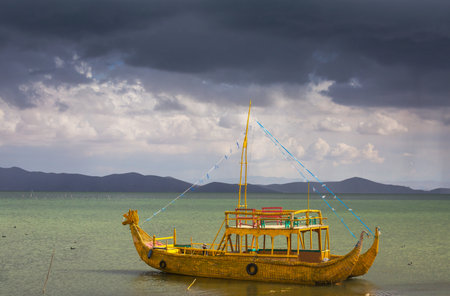 Totora boat on the Titicaca lake in Boliviaの写真素材