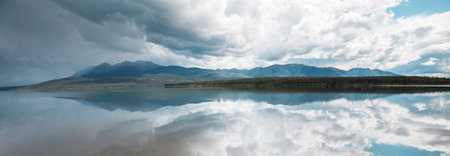 Serene scene by the mountain lake in Canadaの写真素材
