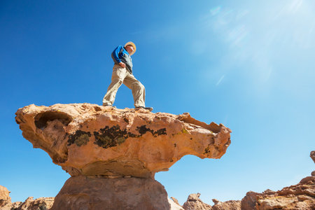Man on the mountains cliff in Bolivia. Hiking scene.の写真素材