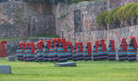 Peruvian dancers with traditional dress in the historical center of Cusco.