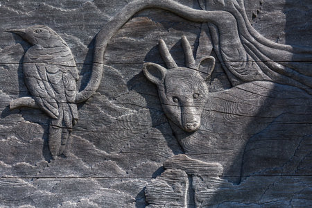 Carved wooden detail -bird and deer close upの写真素材