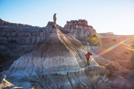 Hiker among badlands in New Mexico, USAの写真素材