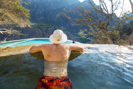 Tourist relaxing in natural thermal pools Las Grutas De Tolantongo in Mexicoの写真素材