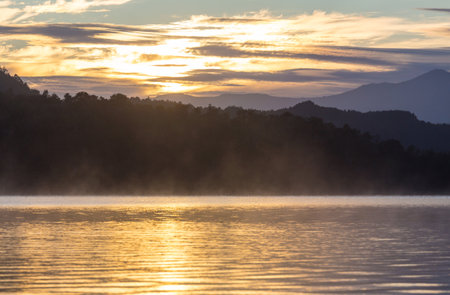 Sunrise scene on beautiful serene lake. Beautiful natural background. Patagonia, Argentina, South America.の写真素材