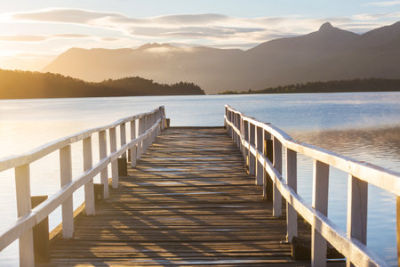 Wooden pier in serenity lake in Patagonia, Argentinaの写真素材