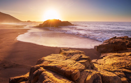 Ocean beach at sunset for natural backgroundの写真素材