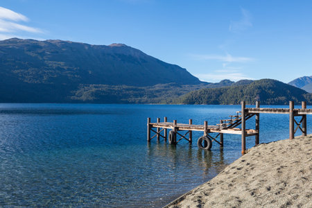 Wooden pier in serenity lake in Patagonia, Argentinaの写真素材