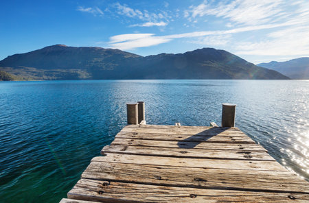 Wooden pier in serenity lake in Patagonia, Argentinaの写真素材