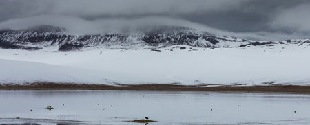 Serenity lake in winter season. Cordillera mountains, Peru, South Americaの写真素材
