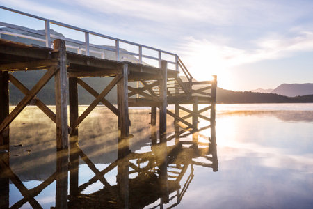 Wooden pier in serenity lake in Patagonia, Argentinaの写真素材