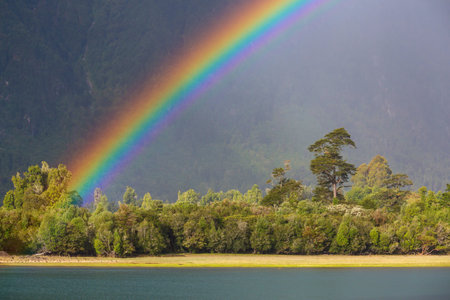 Rainbow above mountains. Beautiful natural landscapes. Picturesque nature.の写真素材