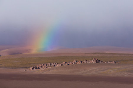 Rainbow above mountains. Beautiful natural landscapes. Picturesque nature.の写真素材