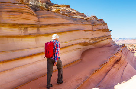 Hike in the Utah mountains. Hiking in unusual natural landscapes. Fantastic forms sandstone formations.の写真素材