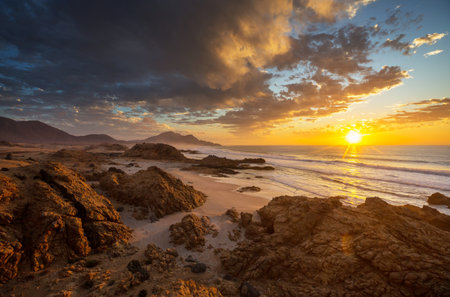 Beautiful rocky beach on the Pacific Ocean in Chile, South Americaの写真素材