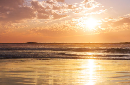 Ocean beach at sunset for natural backgroundの写真素材