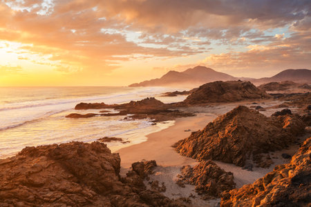 Beautiful rocky beach on the Pacific Ocean in Chile, South Americaの写真素材