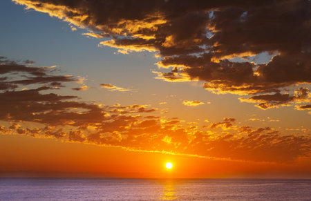 Ocean beach at sunset for natural backgroundの写真素材
