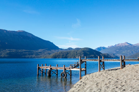 Wooden pier in serenity lake in Cordillera mountains, Peruの写真素材