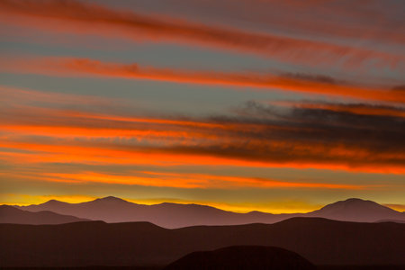 mountain silhouette at sunrise in Chile,  South Americaの写真素材