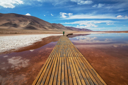 Man walking in the mountains in Northern Argentina, South Americaの写真素材