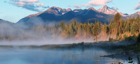 Serene scene by the mountain lake in Canadaの写真素材