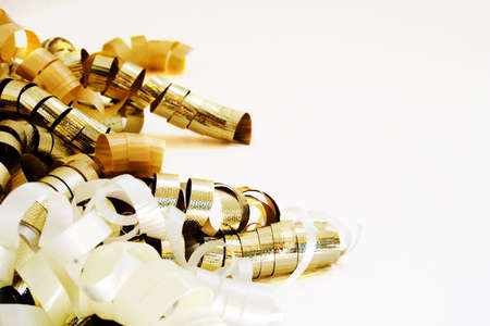 Gold and white curly ribbon isolated on white backgroundの写真素材