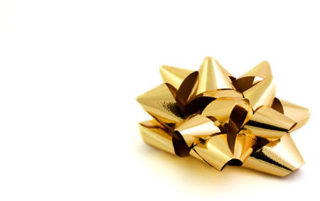 Gold bow isolated on white backgroundの写真素材