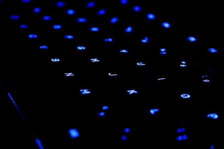 Blue neon Keyboard in a dark areaの写真素材